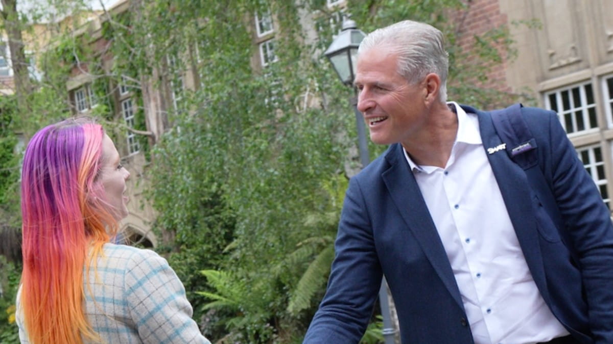 SMART Technologies Chief Commercial Officer, Jeff Lowe, shaking hands with Jess Rowlings, Co-founder and CEO of Next Level Collaboration.