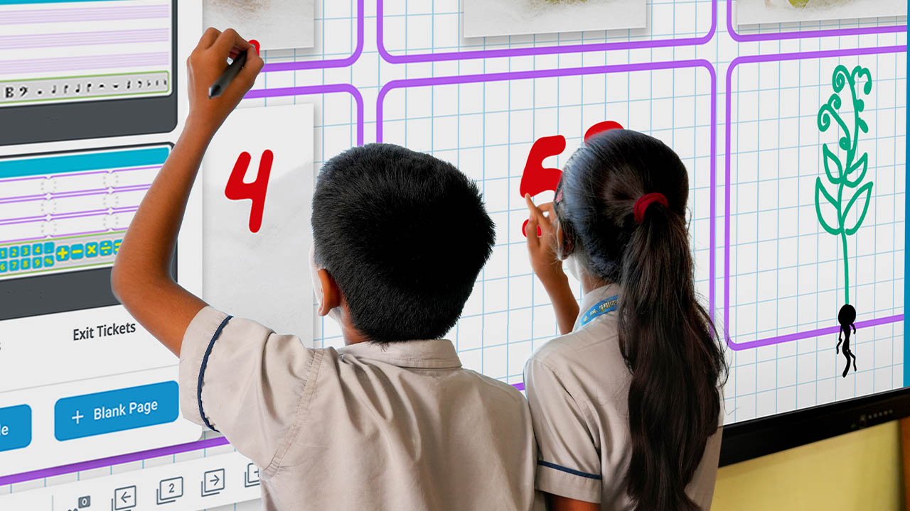 Back view of two students writing on a SMART Board, collaboratively listing country names during a classroom activity.