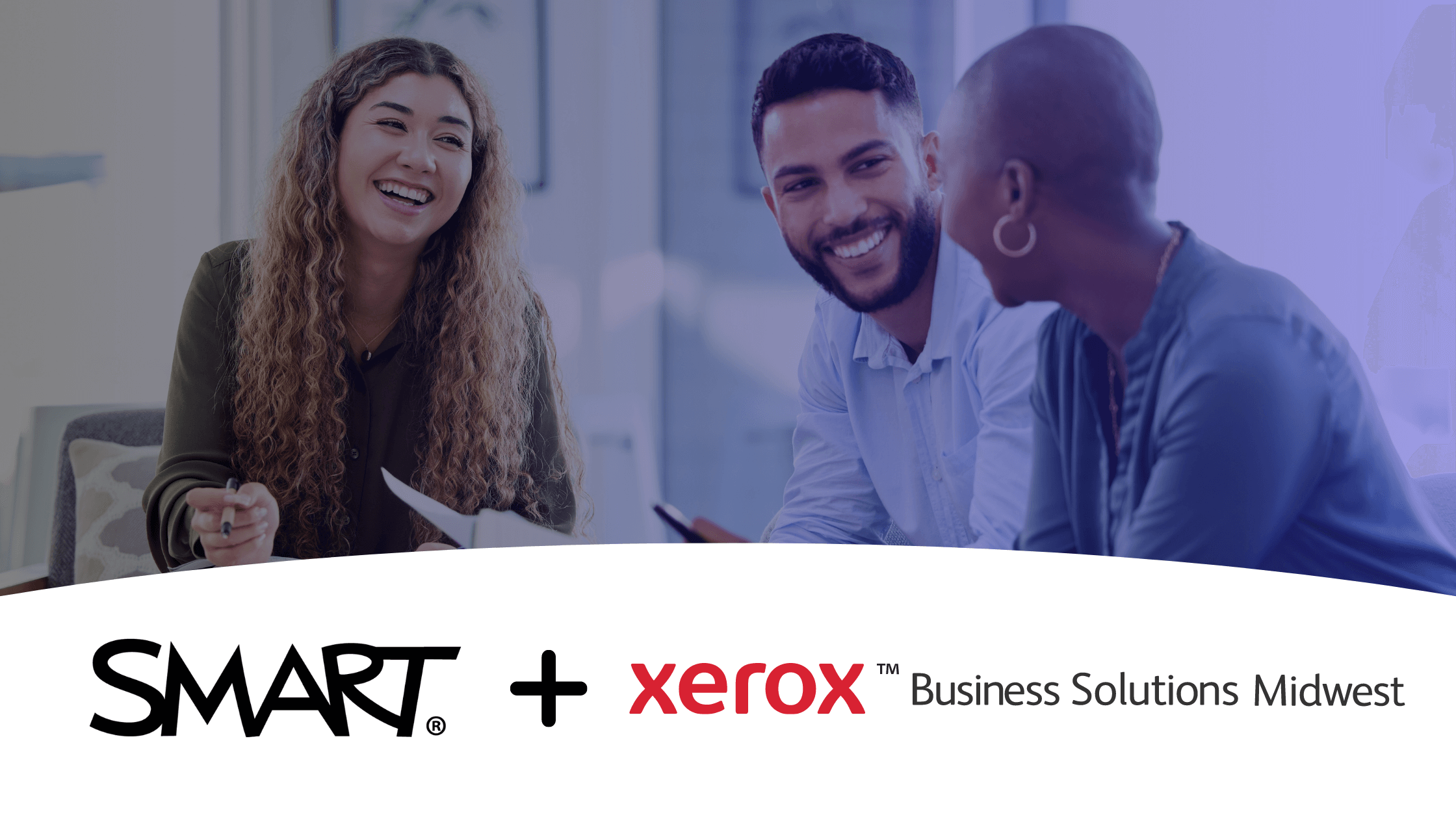 Three professionals engaging in an informal chat at work provided by SMART and Xerox Business Solutions Midwest.
