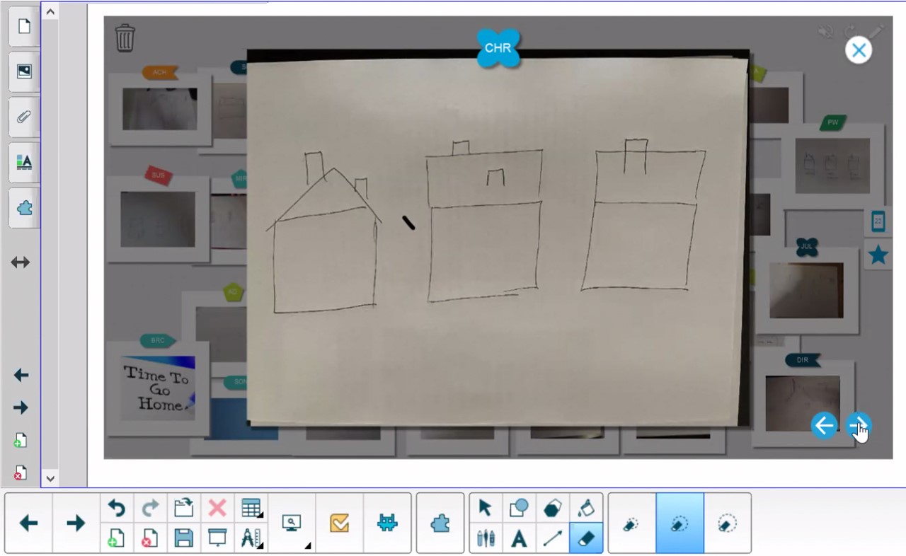SMART Notebook interface featuring hand-drawn houses as part of an educational activity.