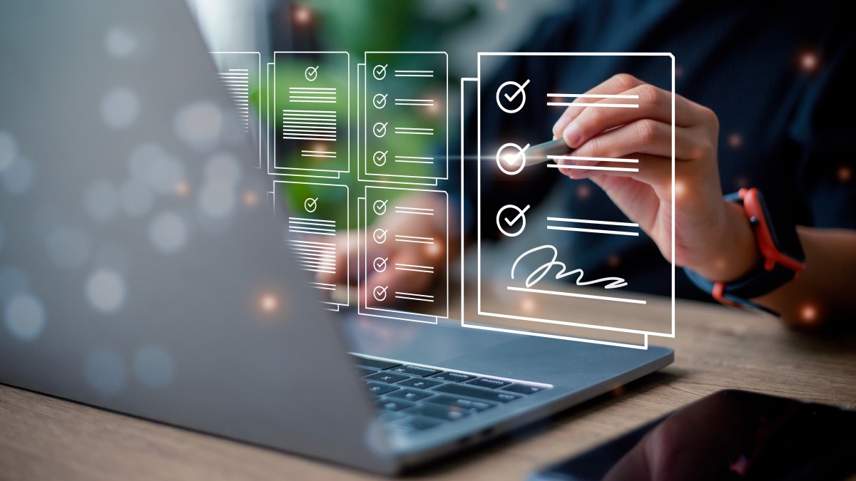 Laptop displaying a modern checklist application with touch interaction.