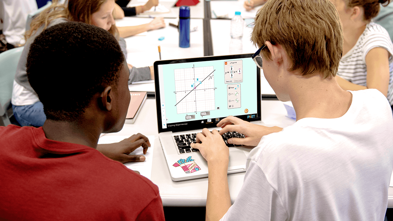 Students in a STEM lab using software on a laptop
