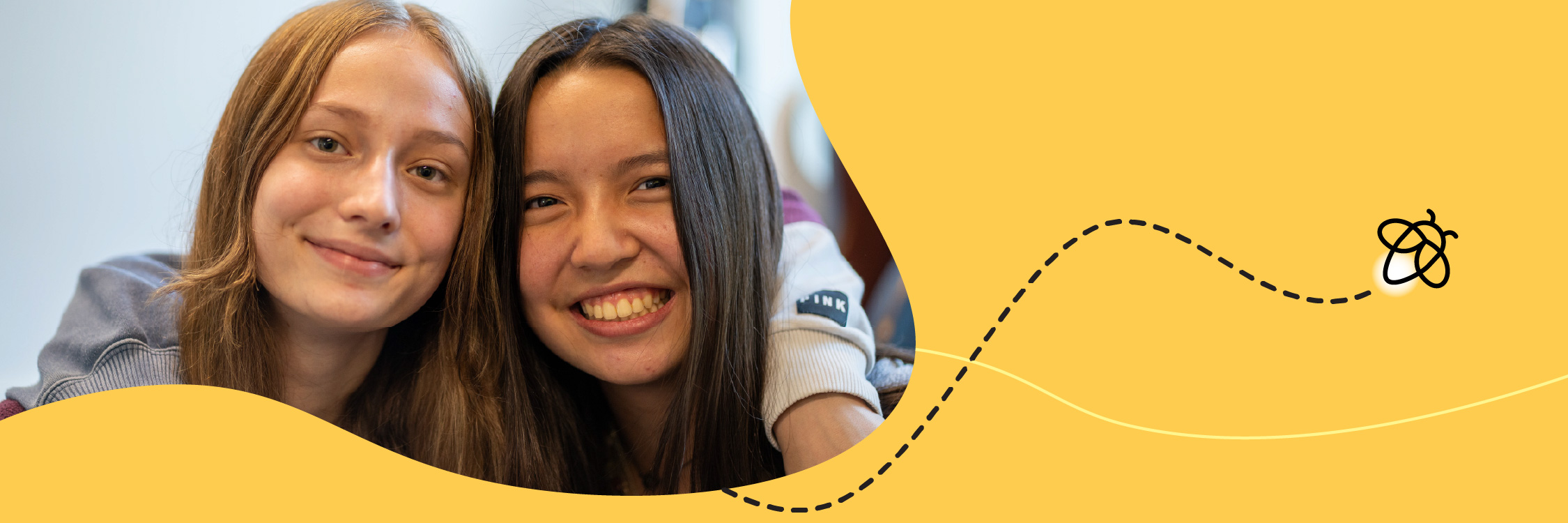 Two students in an embrace.