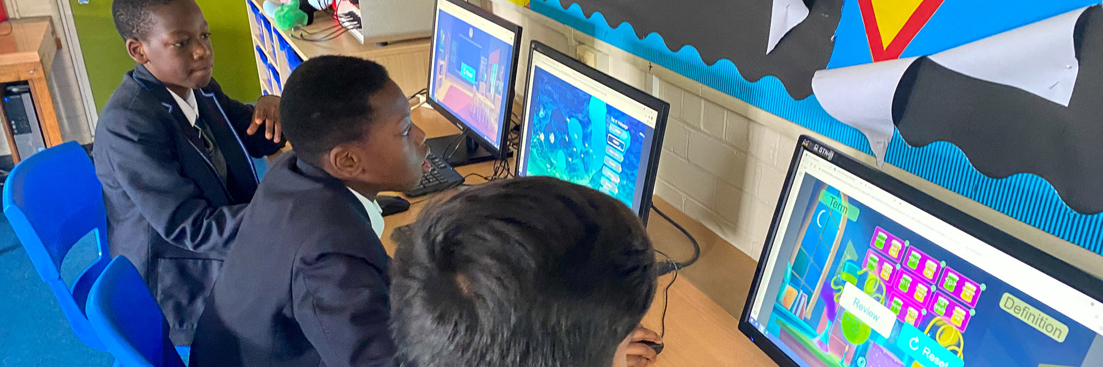 Three students engaging in game-based learning online.