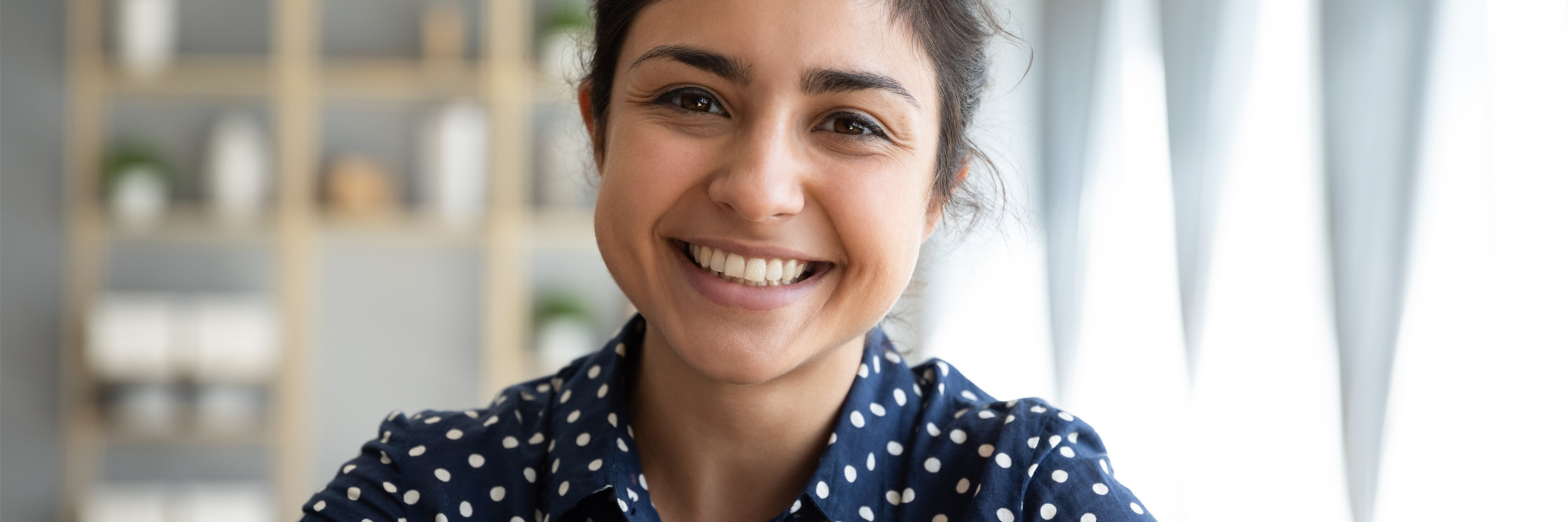 A close up of a smiling teacher.