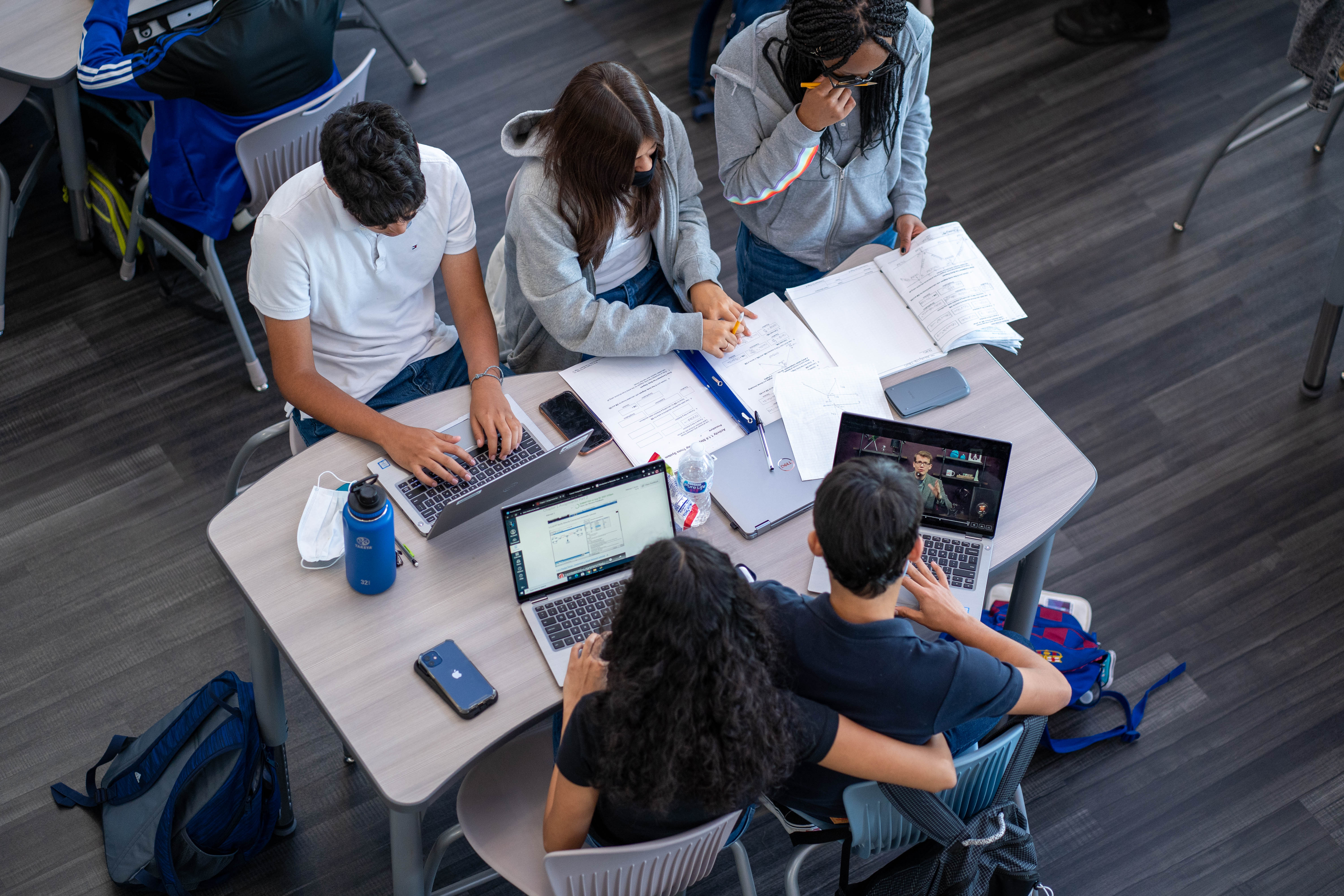 Students collaborate during study hall on their student devices.