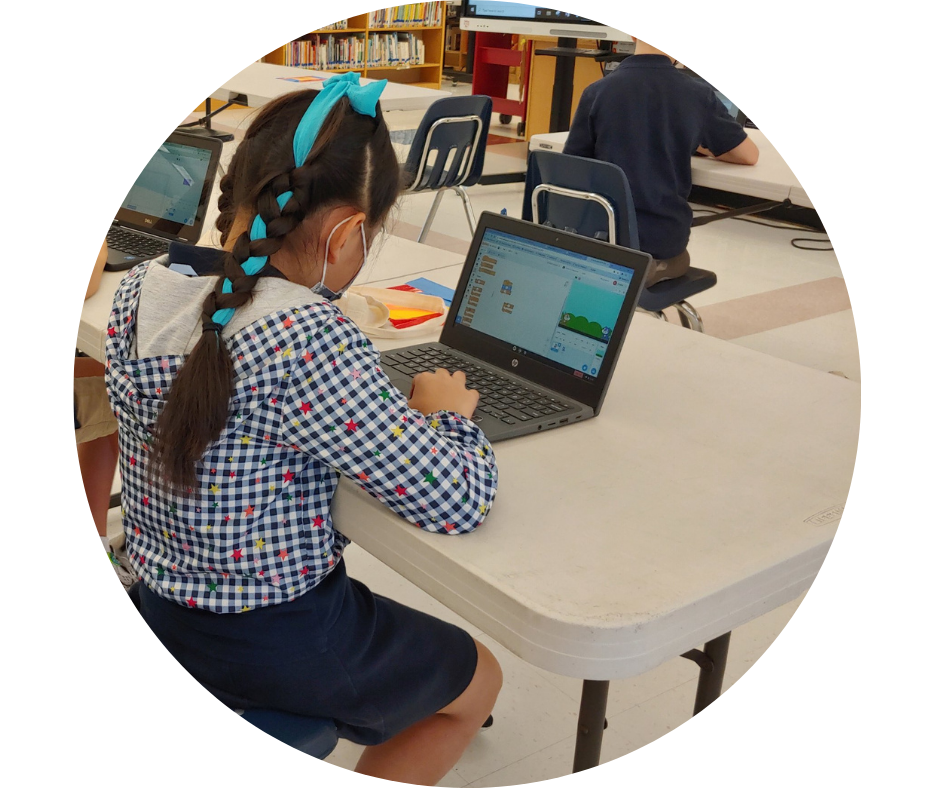 Young female student coding with Lumio by SMART