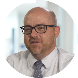 Michael Meechin, Principal at NeoCity Academy, smiling during an interview.