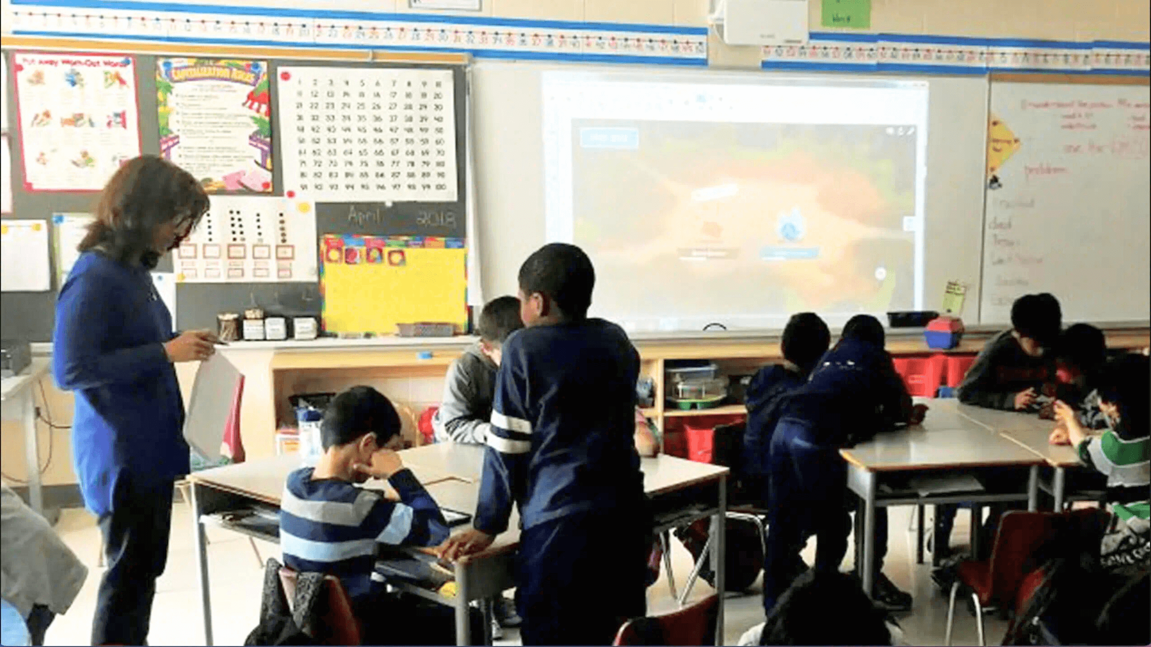 Students completing a Lumio game-based activity individually and collaboratively.