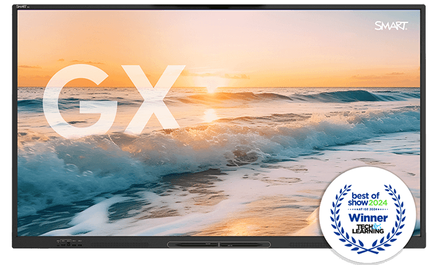 The GX-V3 display showcasing a stunning beach sunset, with the large letters 'GX' superimposed on the image. In the corner, a 'Best of Show 2024' award badge from Tech & Learning at the ISE event signifies the product's achievement.